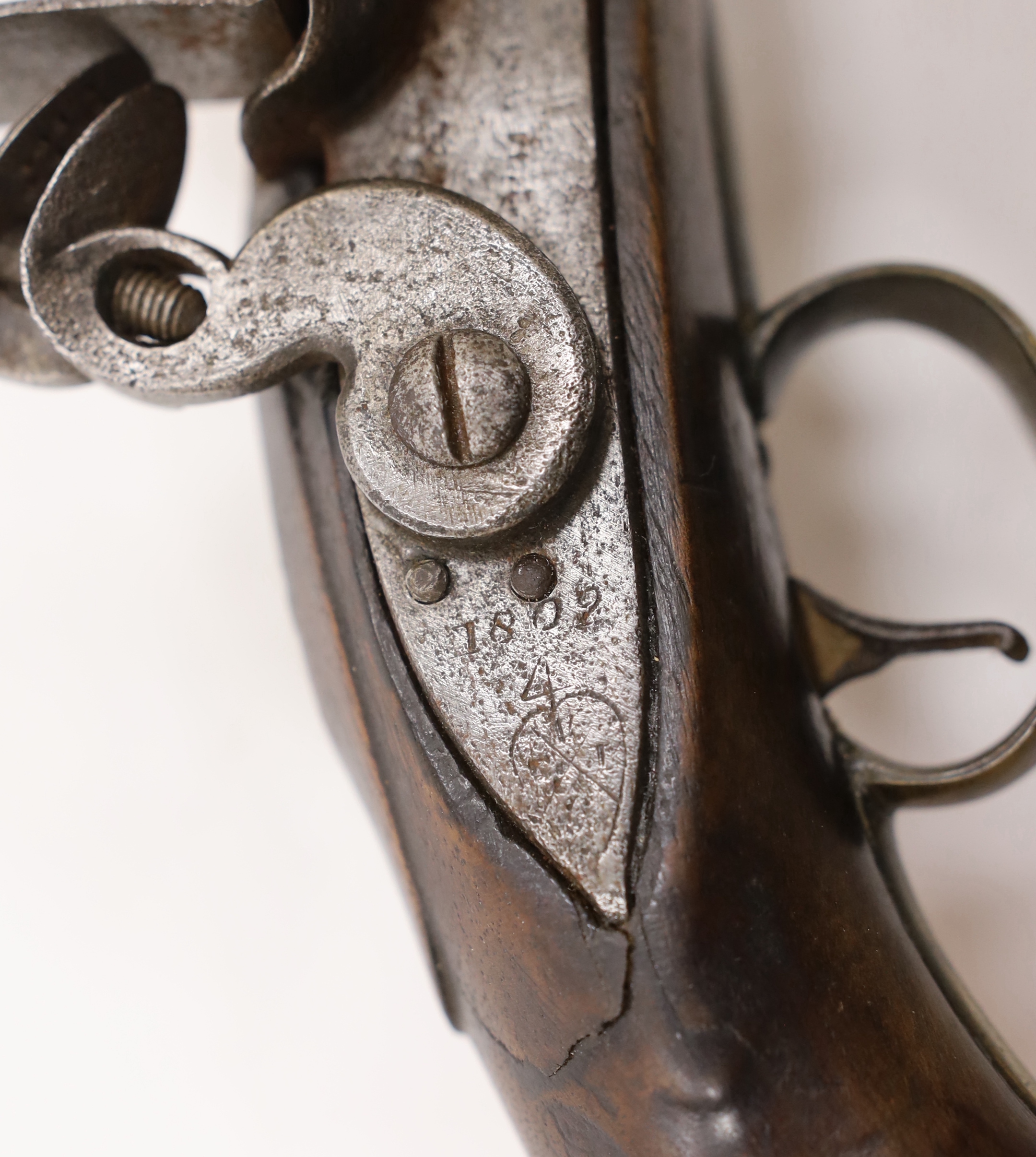A 16 bore in East India company, Flintlock holster, pistol, barrel, engrave with EIC heart mark and makers name, dated 1802 lock plate also engraved 1802, VEIC with regulation brass mounts reconverted from percussion